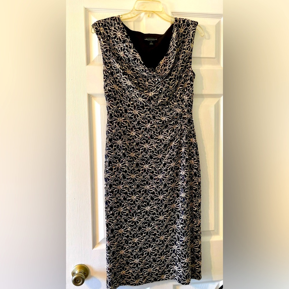 Ladies dress size 8 beautiful slouchy neckline. Worn once in perfect condition.